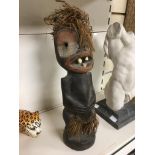 AN AFRICAN CARVED WOODEN FIGURE WITH REAL TEETH, APPROX 37CM HIGH