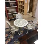 A GALVANISED GARDEN TABLE WITH THREE GALVANISED CHAIRS