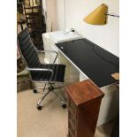 A MODERN DESK WITH ADDITIONAL ITEMS INCLUDING SWIVEL OFFICE CHAIR AND CD RACK