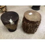 TWO TRIBAL DOUBLE ENDED DRUMS ONE COWHIDE, LARGEST 24.5CMS HIGH