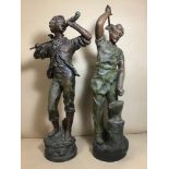 A PAIR OF 19TH CENTURY PAINTED SPELTER FIGURES, ONE OF A BLACKSMITH, THE OTHER A YOUTH WITH HORN,