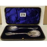 AN EDWARDIAN PAIR OF ORNATE SILVER SERVING SPOONS WITH SHELL SHAPED BOWLS, HALLMARKED SHEFFIELD 1901