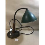 A MID CENTURY METAL AND WOOD DESK LAMP WITH GREEN ENAMEL SHADE, THE BASE WITH ORIGINAL BAKELITE