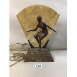 AN ART DECO MARBLE TABLE LAMP WITH BRONZE FIGURE ADORNING THE FRONT OF A FEMALE DANCER IN DECO