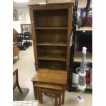 A PINE FIVE SHELF BOOKCASE 183CM HIGH, TOGETHER WITH A SIMILAR NEST OF THREE TABLES