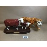 A BESWICK FIGURE OF A LEOPARD, 30CM LONG, TOGETHER WITH A BESWICK FIGURE GROUP OF A COW AND CALF