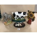 THREE VINTAGE METAL DOOR STOPS WITH A METAL POT STAND AS ANIMALS AND FLOWERS