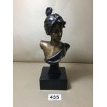 AN ART NOUVEAU BRONZE HEAD AND SHOULDER BUST OF A LADY, RAISED UPON A STONE BASE, 26CM HIGH