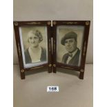 A CIRCA 1940S DUAL FOLDING PHOTO FRAME