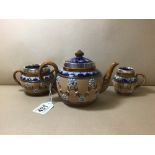 AN EDWARDIAN THREE PIECE SILVER MOUNTED ROYAL DOULTON STONEWARE TEA SET, COMPRISING TEA POT, TWIN