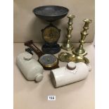 A SALTER KITCHEN SCALES WITH TWO STONE WATER BOTTLES AND BRASS CANDLESTICKS