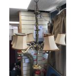 A PAIR OF BRASS SIX BRANCH CHANDELIARS, ELECTRIFIE