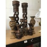 FOUR PAIRS OF AFRICAN CARVED TRIBAL WOODEN CANDLESTICKS, LARGEST 54CM HIGH