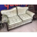 A VICTORIAN UPHOLSTERED SOFA ON CASTORS A/F