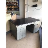 AN INDUSTRIAL SEVEN DRAWER DESK