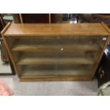 A MID CENTURY GLASS FRONTED BOOKCASE