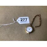 AN EARLY 15CT GOLD CASED LADIES WRISTWATCH, THE EN