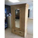 A VICTORIAN WASHED PINE WARDROBE WITH MIRROR AND DRAWER