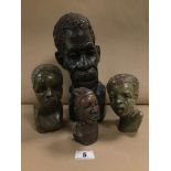 A GROUP OF FOUR AFRICAN CARVED STONE BUSTS, SOME B