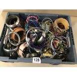 A LARGE BOX OF COSTUME JEWELLERY INCLUDING BANGLES