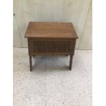 A 20TH CENTURY CARVED CARVED OAK SEWING BOX/SEAT,