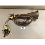 A COPPER AND BRASS MILITARY BUGLE WITH MILITARY CREST TO END OF HORN, 27CM LONG