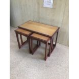 A MID CENTURY NEST OF THREE TABLES IN ROSEWOOD