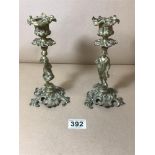 A PAIR OF 19TH CENTURY BRASS CANDLESTICKS, THE STEMS FORMED AS PEASANT FIGURES, 20 CM HIGH