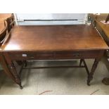 A TWO DRAWER MAHOGANY CONSOLE TABLE ON ORIGINAL CASTORS