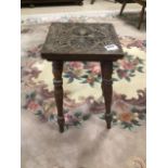 A SMALL CARVED TOP MIDDLE EASTERN SIDE TABLE