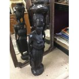 A LARGE HEAVY AFRICAN CARVED WOODEN FIGURE OF A TRIBESWOMEN, 85CM HIGH