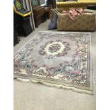 A LARGE BEIGE RUG WITH PATTERN FLOWERS 244 X 308 CM