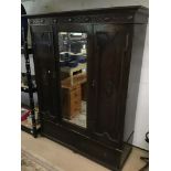 A ART NOUVEAU DOUBLE WARDROBE WITH MIRROR AND TWO BOTTOM DRAWERS IN OAK