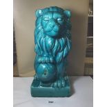 A LARGE CRACKLE GLAZE POTTERY FIGURE OF A LION, TURQUOISE IN COLOUR, 48 CM HIGH