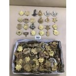 A LARGE COLLECTION OF ASSORTED MILITARY CAP BADGES