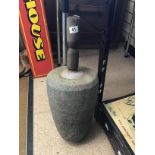 AN UNUSUALLY LARGE HEAVY STONE PESTLE WITH WOODEN HANDLE, 63CM HIGH