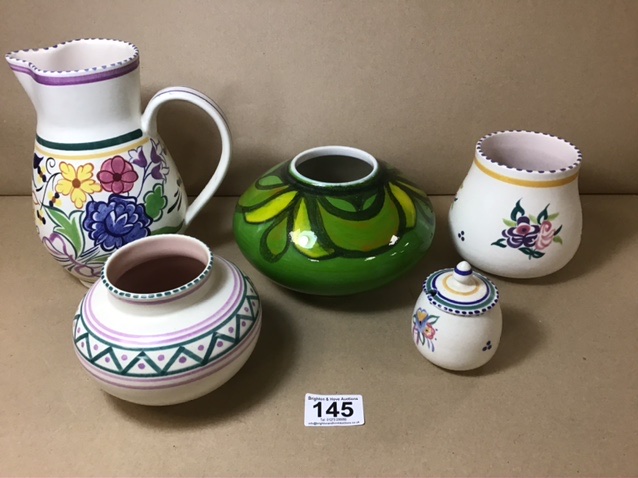 FIVE PIECES OF POOLE POTTERY, INCLUDING CASES AND A WATER POURER