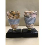 A PAIR OF MODERN MARBLE CANDLE HOLDERS RAISED UPON WOODEN BASES, 20CM HIGH