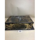 AN ORNATE LACQUER WOOD WRITING SLOPE HIGHLY DECORATED WITH GILT AND MOTHER OF PEARL THROUGHOUT,