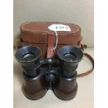 A PAIR OF 20TH CENTURY BINOCULARS WITH LEATHER GRIPS, MARKED 10 LENSES, IN ORIGINAL LEATHER CASE