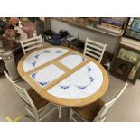 AN EXTENDING TILE TOP KITCHEN TABLE WITH FOUR CHAIRS