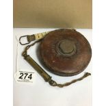 AN EARLY LEATHER CASED CHESTERMAN TAPE MEASURE, MADE IN SHEFFIELD, ENGLAND, TOGETHER WITH A BRASS