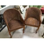 A PAIR OF WICKER SWAN ARMCHAIRS