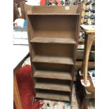 A SIX TIER WOODEN SHELF UNIT