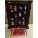 A COLLECTION OF FRANKLIN MINT MINIATURE CLOCKS IN A WOODEN DISPLAY UNIT, TWELVE IN TOTAL