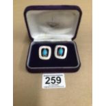 A PAIR OF EASTERN EUROPEAN 950 GRADE SILVER CLIP EARRINGS, EACH SET WITH SINGLE CAOCHON TURQUOISE,