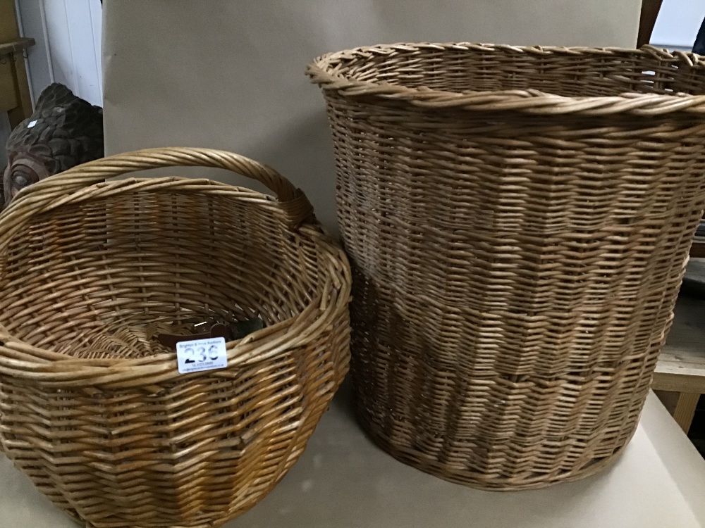 A LARGE WICKER RUBBISH BIN AND A SINGLE HANDLED BASKET