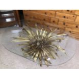 AN ORNATE ROCOCO STYLE BRASS AND GLASS COFFEE TABLE