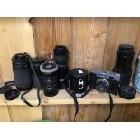 SEVEN CAMERA LENSES AND A CAMERA (COSMIC 35)