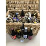 A WICKER BASKET CONTAINING NUMEROUS LIMITED EDITION CHARLES & DIANA WEDDING BEERS 1981, SOME